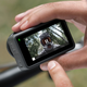 The large touchscreen display on the back of a DJI Osmo Action 3 action camera being used.